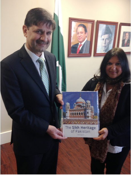 Pakistani Consul General Dr. Muhammad Tariq presents “The Sikh Heritage of Pakistan” to Indira Prahst.